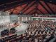 A large congregation attending a conference in a modern church setting.