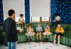 BREAKING: Former Teacher Reads Newark Kids to Brighter Futures Preschool teacher leading storytime with children reading books in a colorful classroom setting.