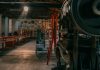 A rustic industrial workshop filled with vintage machinery and tools.