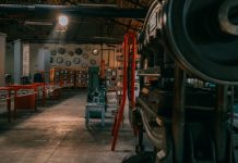 A rustic industrial workshop filled with vintage machinery and tools.