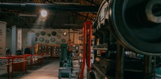 A rustic industrial workshop filled with vintage machinery and tools.