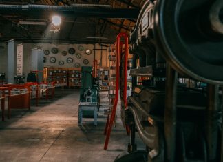 A rustic industrial workshop filled with vintage machinery and tools.