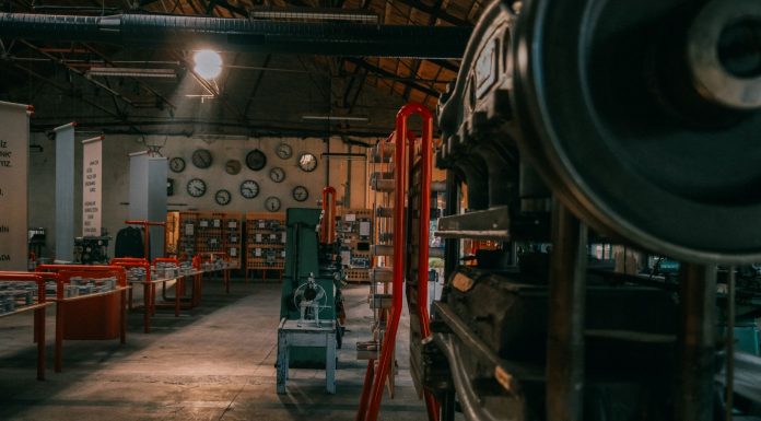A rustic industrial workshop filled with vintage machinery and tools.