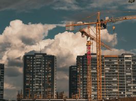 BREAKING: Jersey City Approves 753-Home Holland Gardens Redevelopment Construction site in Istanbul with cranes and buildings under a dramatic cloudy sky.