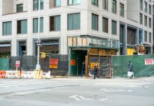 BREAKING: Joboken Cafe Faces Construction Challenges, Community Rallies City streetscape featuring a building under construction with closed sidewalk signage.
