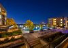 Night view of a luxurious apartment complex with a swimming pool in Westminster, Colorado, USA.