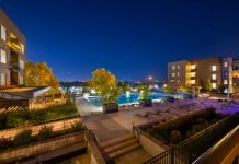 Night view of a luxurious apartment complex with a swimming pool in Westminster, Colorado, USA.