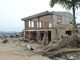 Partially destroyed building in Mocoa, Colombia, illustrating damage and abandonment.