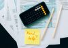 BREAKING: New Tool Helps NJ Families Claim $1,000 Child Tax Credit Top view of financial papers with a calculator, pencils, and a note saying 'Need help?' indicating tax or accounting assistance.