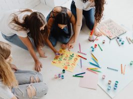 BREAKING: Newark Community Art Project ‘The Golden Life’ Debuts in Documentary Group of women designing artistic placards with colorful materials.