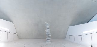 A minimalist and futuristic interior featuring stacked stones and white walls.