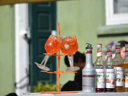 Halifax in Hoboken Serves Aperol Spritz Trees for Summer Send-Off Colorful Aperol Spritz and Monin syrups on display outdoors, perfect for summer cocktails.