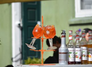 Halifax in Hoboken Serves Aperol Spritz Trees for Summer Send-Off Colorful Aperol Spritz and Monin syrups on display outdoors, perfect for summer cocktails.