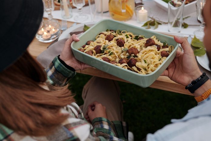 hoboken-s-spaghetti-dinner-block-party-returns-sep Aerial view of a delicious pasta and meatball dish being served at a cozy outdoor gathering.