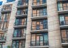 How Much Does It Cost to Rent in Newark in 2026? A Local’s Guide Contemporary apartment building exterior with concrete facade and glass balconies.