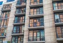 How Much Does It Cost to Rent in Newark in 2026? A Local’s Guide Contemporary apartment building exterior with concrete facade and glass balconies.