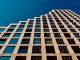 How to Find an Apartment in North Bergen in 2026: A Local’s Guide A modern high-rise building in Eindhoven, Netherlands with a clear blue sky backdrop.
