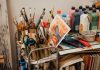 Colorful art studio corner with brushes, paints, and a painted canvas. Ideal for creative inspiration.