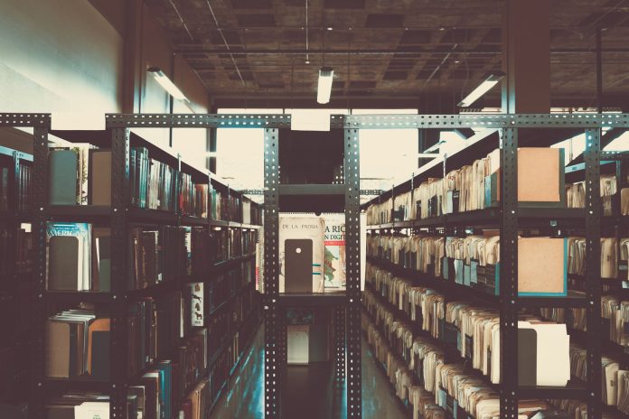 Bookshelves in a library with a vintage tone in San José, Costa Rica.