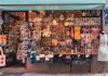 A colorful display of Swedish souvenirs in a quaint shopfront in Stockholm's Gamla Stan district.
