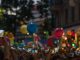 Jersey City Tower Wi-Fi Collapses Under Event Crowds A lively crowd captures a festive street scene filled with colorful balloons and vibrant energy.