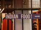 Kati Roll Company Plans Second Jersey Spot in Hoboken Indoor setting with a large sign reading 'Indian Food' pointing directionally.