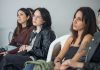 Focused individuals attending an indoor seminar, showcasing engagement and learning.