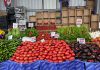 Fresh produce at a bustling Istanbul market showcasing tomatoes, peppers, and more.