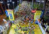 Vivid start of a midnight marathon in Ho Chi Minh City with a large crowd.