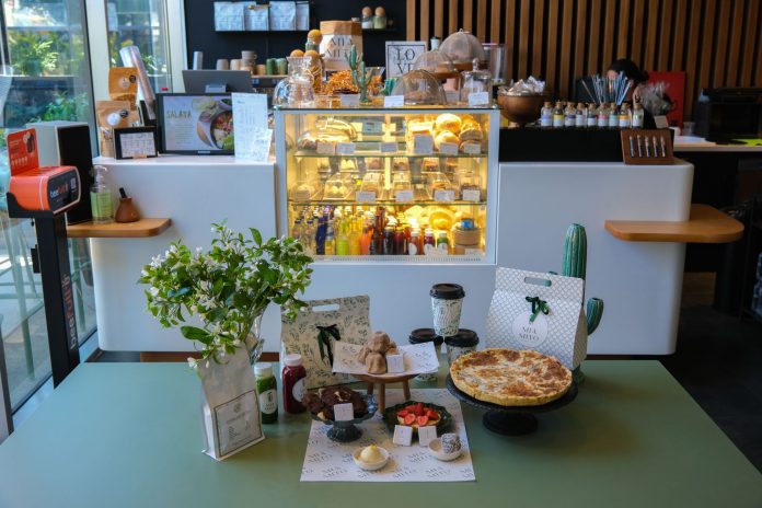 Charming cafe interior in Ankara featuring a variety of pastries and drinks on display.