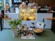 Charming cafe interior in Ankara featuring a variety of pastries and drinks on display.