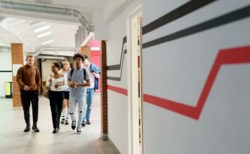 Stevens Taps Brendan Englot as Interim Dean for New School of Computing A diverse group of teenagers walking together in a modern school hallway.