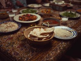 A vibrant spread of Indian dishes on a colorful tablecloth, perfect for culinary themes.