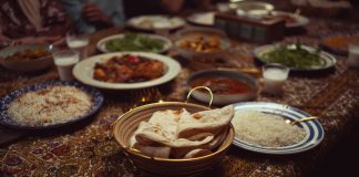 A vibrant spread of Indian dishes on a colorful tablecloth, perfect for culinary themes.