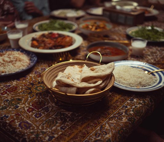 A vibrant spread of Indian dishes on a colorful tablecloth, perfect for culinary themes.
