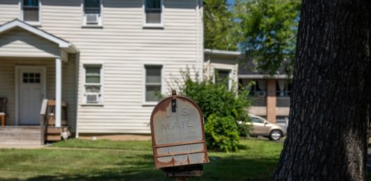Best Areas to Raise a Family in Newark: A Local’s Guide for 2026 A vintage US mailbox stands outside a suburban home in New Jersey, illustrating classic American life.