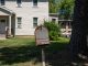 A vintage US mailbox stands outside a suburban home in New Jersey, illustrating classic American life.