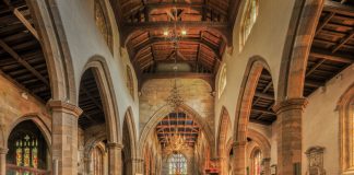 Discover the Best Churches in Bayonne, NJ: A Local’s Guide for 2026 A beautifully detailed view of the nave inside a historic English church, showcasing gothic architecture.