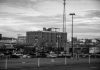 Black and white view of an urban cityscape in Tulsa, Oklahoma featuring buildings and parking lots.