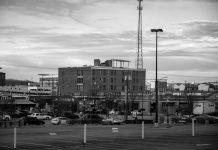 Black and white view of an urban cityscape in Tulsa, Oklahoma featuring buildings and parking lots.