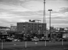 Black and white view of an urban cityscape in Tulsa, Oklahoma featuring buildings and parking lots.