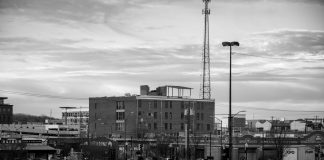 Black and white view of an urban cityscape in Tulsa, Oklahoma featuring buildings and parking lots.