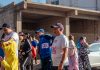 Participants engage in a vibrant marathon event, showcasing diverse attire and lively atmosphere.