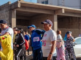 BREAKING: Hudson County Adds First-Ever Kids Fun Run to 5K Against Gun Violence Participants engage in a vibrant marathon event, showcasing diverse attire and lively atmosphere.