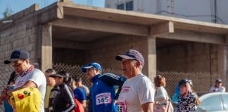 Participants engage in a vibrant marathon event, showcasing diverse attire and lively atmosphere.