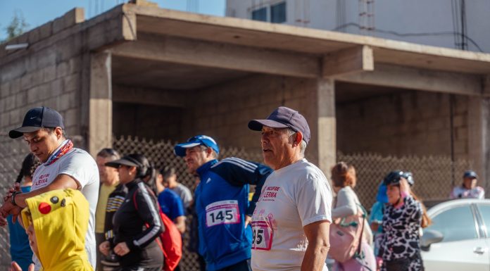 Participants engage in a vibrant marathon event, showcasing diverse attire and lively atmosphere.