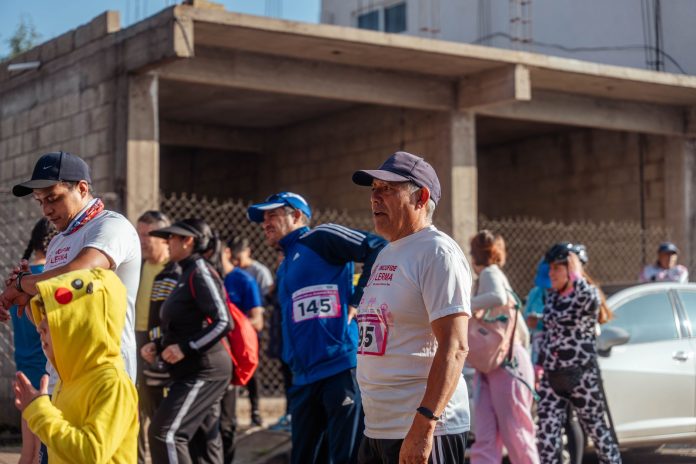 Participants engage in a vibrant marathon event, showcasing diverse attire and lively atmosphere.