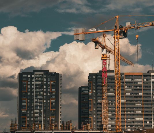 BREAKING: Jersey City Approves 1,517-Unit Homestead Market Project Construction site in Istanbul with cranes and buildings under a dramatic cloudy sky.