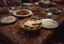 A vibrant spread of Indian dishes on a colorful tablecloth, perfect for culinary themes.