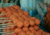 Close-up of skewered fried street food balls, perfect for food and travel visuals.
